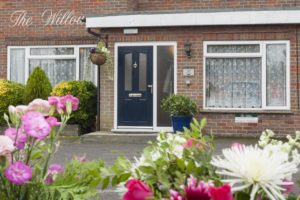 Entrance to residential home with flowers