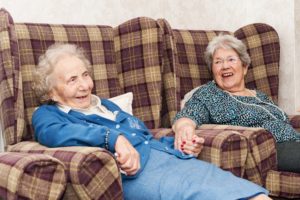 Two residents holding hands