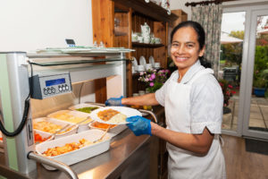 Praveena serving food