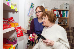 Claire helping out resident in the little shop