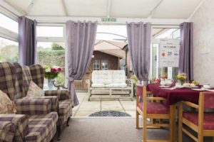 Seating room with door open to patio area