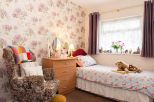 bedroom with floral armchair